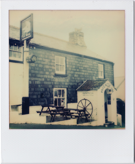 Sometimes a photo can truly capture a memory and picture the scene as was. A mornings walk and a battering of wind and rain along cliff tops saw us to this pub; a wonderful beacon - a respite against the weather.  A chance to dry off in front of the fire with a plate of food and a couple of pints. 