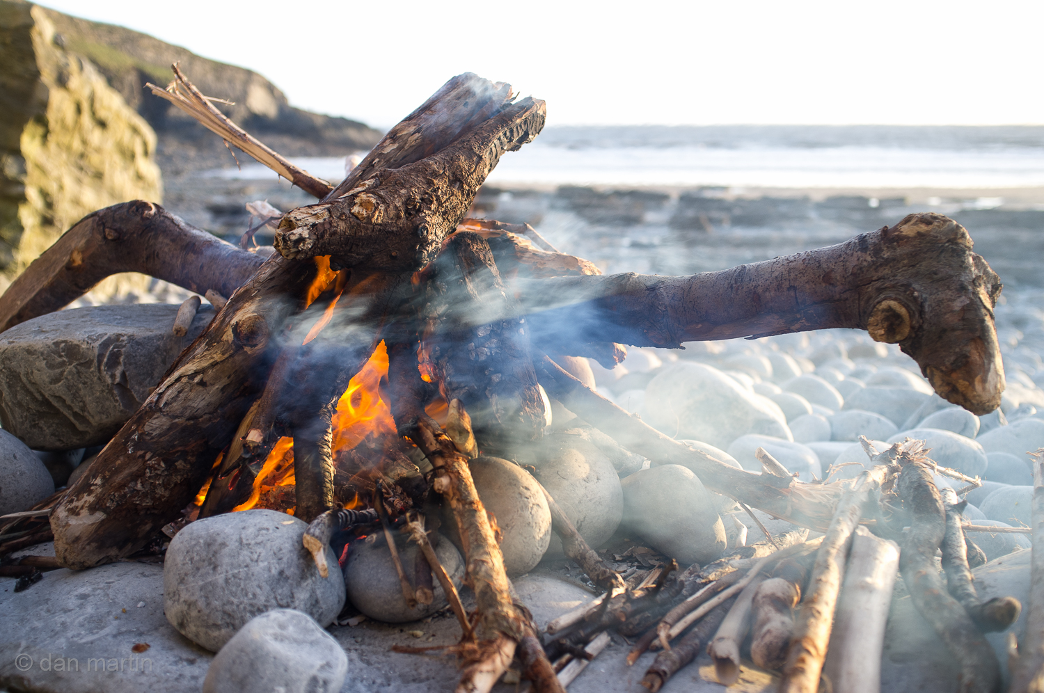 Such warm feelings fire, beach and sea. Content.