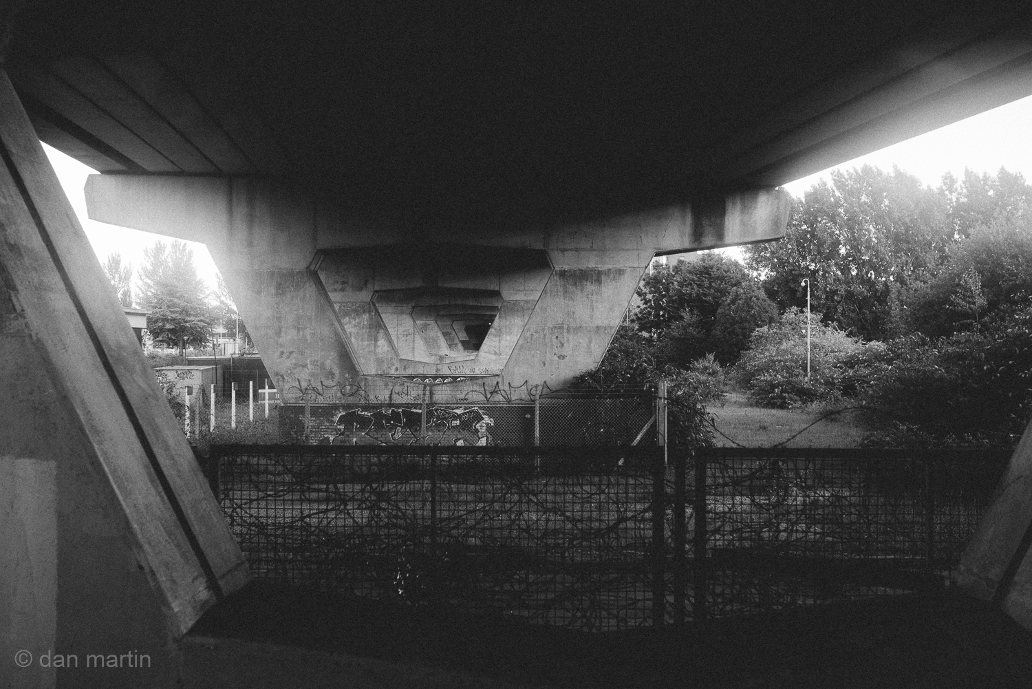 A world of Black and white. Slow panning shots, street lamps in the distance. Probably a bit of mist. 