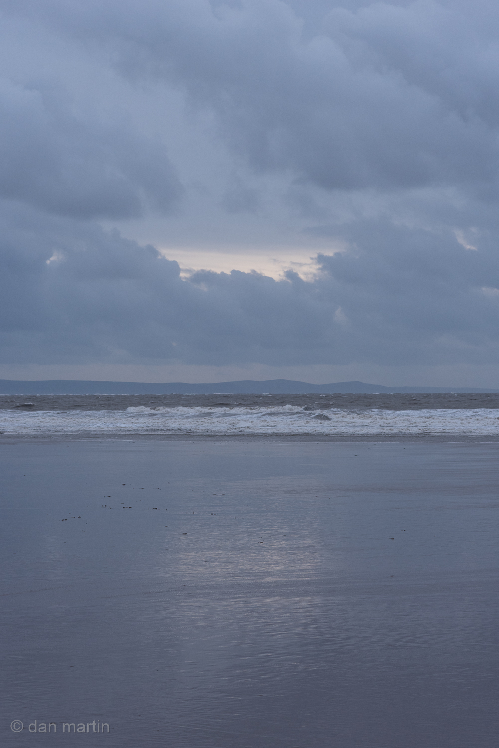 A brief moment - the clouds part. The glint of light reflected on the water.